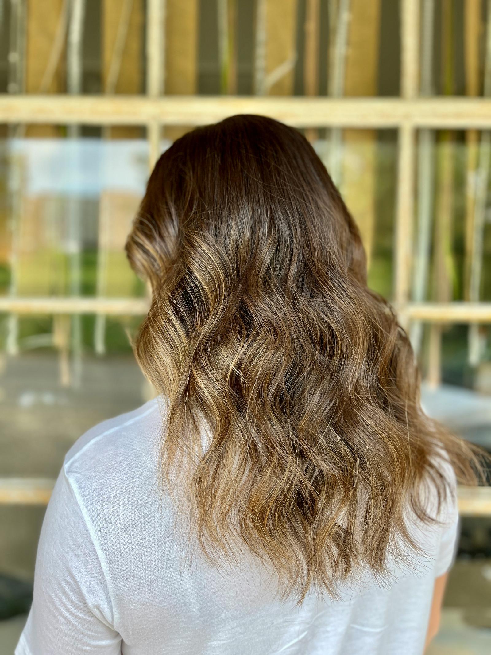 Woman with fresh haircut and styling in Oceanside
