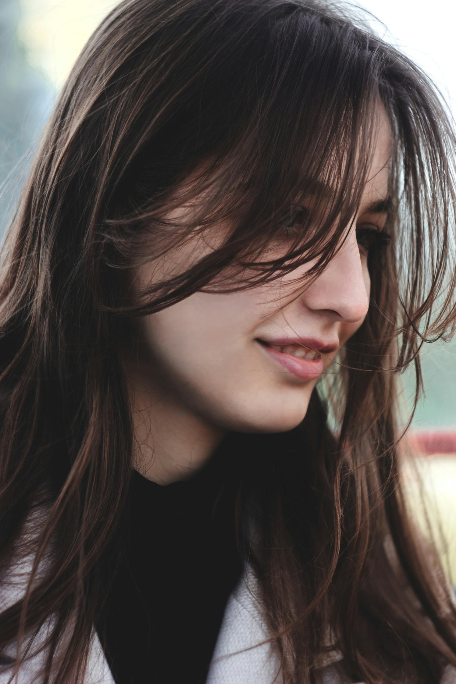 Woman with soft curtain bangs in Oceanside