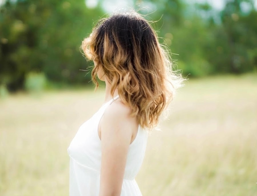Close-up of natural balayage highlights in sunlight